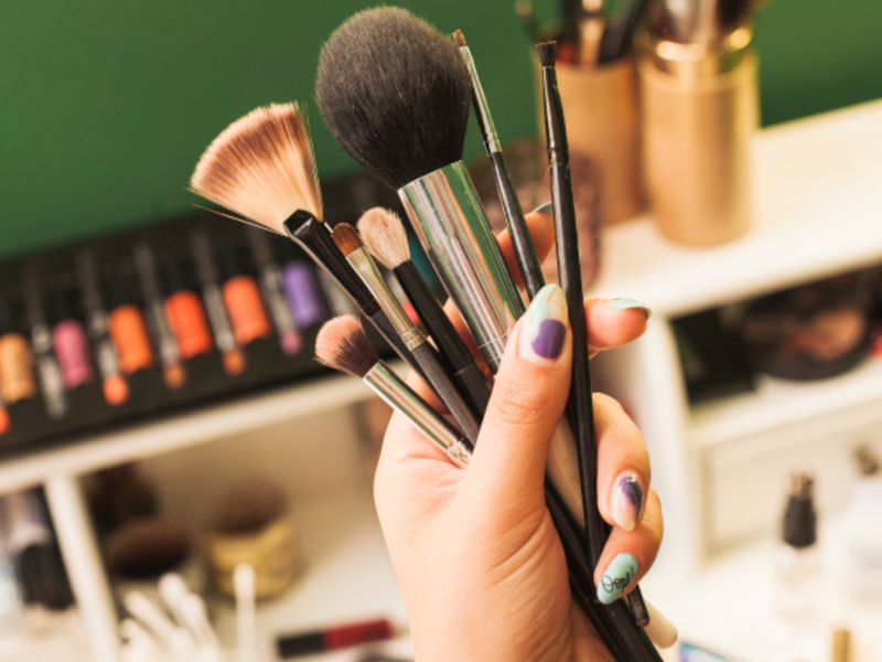 A closeup shot of professional makeup brushes and tools