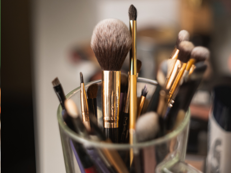 A closeup shot of professional makeup brushes and tools